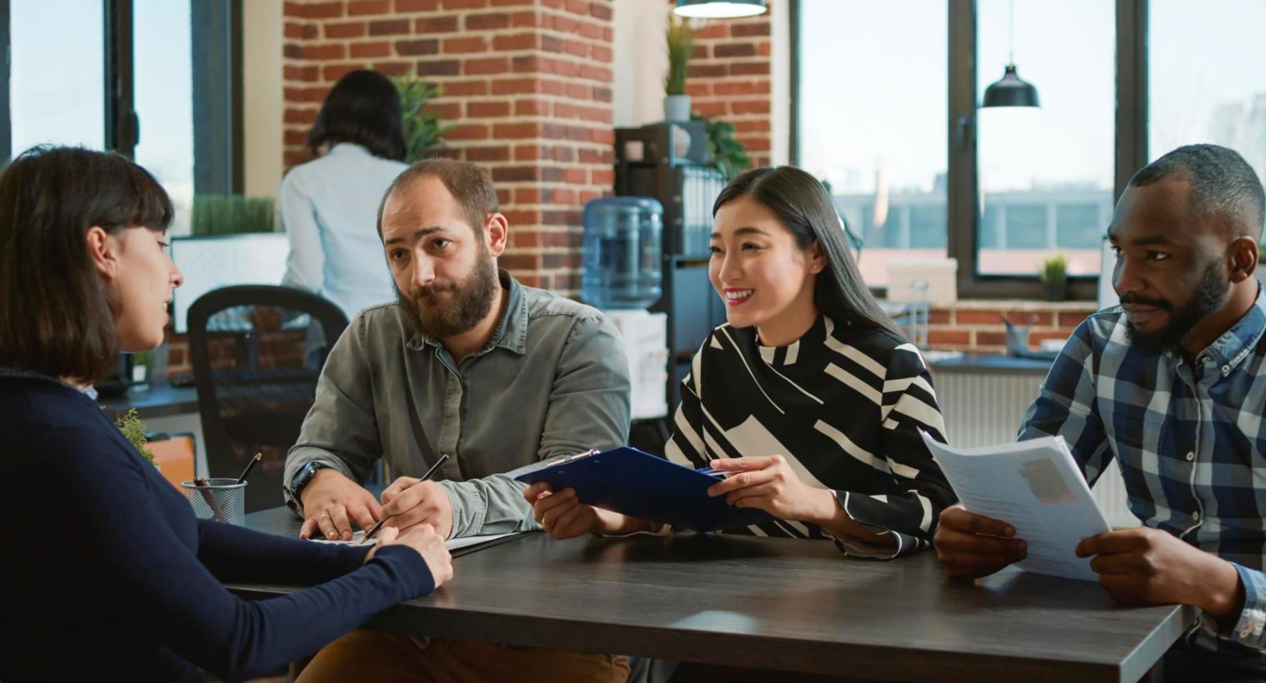 Detailed financial charts and analytical tools spread across a modern workspace